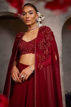 Maroon cape with sequin, cutdana, bead, floral applique embroidery. Paired with sleeveless embroidered padded bustier and attached cancan skirt. - Aza Fashions Fusion Style Saree Set For Wedding, Fitted Choli With Cape Sleeves For Festivals, Festive Lehenga With Cape, Fitted Cape Set With Dupatta, Red Party Sets With Cape Sleeves, Fusion Style Red Dupatta For Wedding, Traditional Evening Cape Sets, Elegant Navratri Sets With Cape Sleeves, Wedding Festive Sharara With Cape