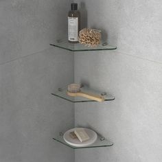 two shelves with soap, toothbrushes and other items on them