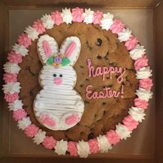 a decorated cookie in the shape of an easter bunny