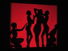 the silhouettes of three women are shown in front of a red background with black shadows