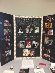 a table topped with pictures and writing on blackboard next to a wall covered in magnets