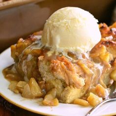 a slice of apple cobbler with ice cream on top is served on a plate