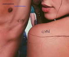 two people with small tattoos on their backs