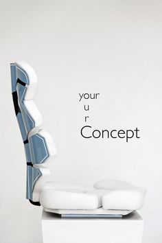 a white and blue chair sitting in front of a wall with the words your u r concept on it