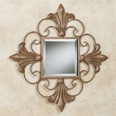 a mirror mounted to the side of a wall next to a beige wallpapered wall