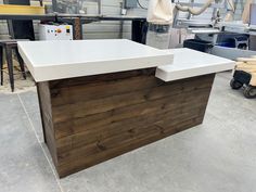 a white counter top sitting inside of a building