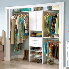 an organized closet with clothes, shoes and other items on it's shelves in a bedroom