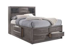 a bed with drawers underneath it and a white blanket on top of the headboard