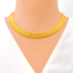 This 22k gold necklace set, weighing 29.8 grams, boasts a reflective and bright artistic design with a radiant yellow gold finish. The 16-inch necklace length, combined with adjustable 1.75-inch links, ensures a perfect fit. Matching 1.1-inch earrings with secure screw-back posts complement the set beautifully. Secured with a hook lock, this set offers a stunning blend of artistry and elegance, making it an ideal choice for those seeking a standout piece for special occasions. PRODUCT DETAILS Gold Purity(karat): 22k Gold Weight(grams): 29.8 Item Finish: Yellow Gold Set Length: 16" Adjustable Links: 1.75" Links Lock Style: Hook Lock Matching Earrings: Included Earring Length: 1.1" Earring Post: Screw Back 22k Gold Necklace Set, 22k Gold Necklace, Bridal Jewelry Necklace, Precious Stones Rings, Diamond Pendant Sets, 16 Inch Necklace, Modern Bracelets, Fancy Necklace, Fancy Rings