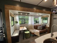 a living room and kitchen area in a mobile home