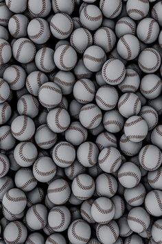 many baseballs are stacked up together in the shape of a ball, and it looks like they're ready to play