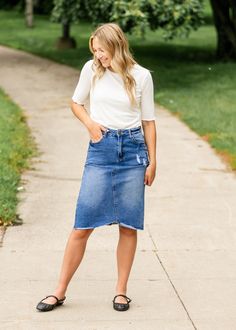 The Tiana Distressed Denim Midi Skirt is a modest and cute denim midi skirt! Designed with backed distressing at the front and back pockets, an uneven raw hem, 5 pockets for holding all the things, and a classic button zipper closure. Style: distressed, denim, midi length Color: Denim Quality control is of the utmost importance to us. Our sizing is always approximate and can also depend heavily on your own body shape. Just like no two people are the same, the same goes for skirts, dresses + tops