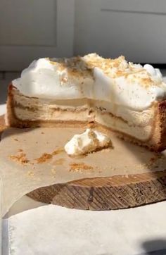 a piece of cake sitting on top of a wooden cutting board