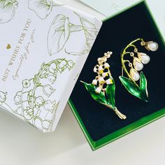 Welcome the vivid beauty of spring with our Vintage Enamel Lily Of The Valley Brooch.  Crafted with delicate details, this brooch pin is a perfect addition to any outfit.  Its delicate white flowers symbolize purity and new beginnings, making it a thoughtful gift for loved ones or a treat for yourself.  The option for choosing a gift box and wrapping specifically designed for lily of the valley is offered. Flower-shaped Brooch For Spring Wedding, Flower Shaped Brooch For Spring Wedding, Flower Shaped Wedding Brooch For Spring, Elegant Flower Brooch For Spring, Spring Brooch Pins As Gifts, Elegant Spring Gift Brooches, Elegant Spring Brooch Jewelry, Gold Brooches For Spring Gift, Elegant Spring Brooch