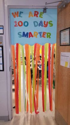 a door decorated with streamers and the words we are 100 days smarter