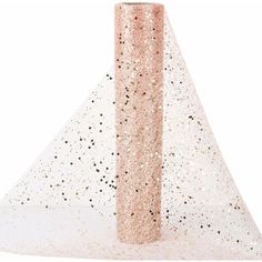 a pink and gold glitter cone on top of a white table