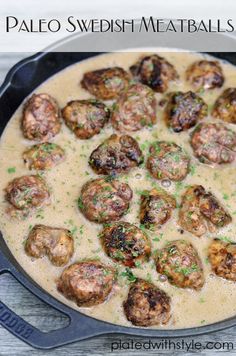 a pan filled with meatballs covered in gravy