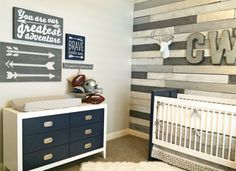 a baby's room with two cribs, dresser and wall art on the walls