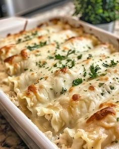 a casserole dish with cheese and parsley