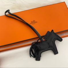 Hermes Milo Lambskin Rodeo Pm Horse Bag Charm So Black/Noir Brand New 3.75”L X 9.25”H Made In France Comes With Box And Ribbon Hermes Horse Charm, Hermes Bag Charm, Hermes Horse, Hermes Crossbody Bag, Hermes Twilly, Birkin Handbags, Arm Art, Hermes Accessories, Vintage Hermes