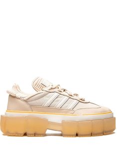 beige leather signature 3-Stripes logo round toe front lace-up fastening logo patch at the tongue pull-tab at the heel branded insole chunky rubber lug sole These styles are supplied by a premium sneaker marketplace. Stocking only the most sought-after footwear, they source and curate some of the most hard to find sneakers from around the world. Ivy Park Sneakers, Adidas Sleek, Adidas X Ivy Park, Adidas Super, Athleisure Brands, Beige Sneakers, Ivy Park, Round Logo, Mood Board Fashion