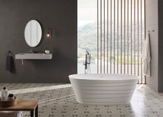 a large white bath tub sitting inside of a bathroom