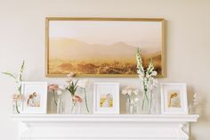 flowers in vases sitting on top of a mantle next to pictures and framed photos