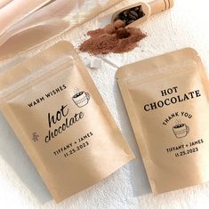 two bags of hot chocolate sitting on top of a towel