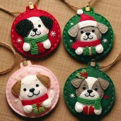 three christmas ornaments with dogs on them