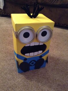 a cardboard box with an image of a minion on it's face and eyes