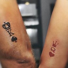 two people with matching tattoos on their arms, one has a crown and the other has a heart