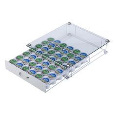 two clear trays filled with green and blue cupcakes