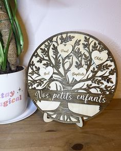 a potted plant sitting next to a wooden sign