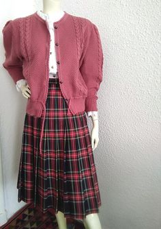 Materials: tartan pendleton skirt 70s checkered midi skirt, plaid tartan skirt, fall skirt, high waist skirt, red preppy skirt, british style skirt, retro elegant office skirt, 30% wool and 70% polyester, lining is 100% viscose. measurements lying flat : waist :38cm (15 inches) hips:51 cm (20 inches) total length :72 cm (28,5 inches) Preppy Red Skirt For Fall, Scottish Style Plaid Skirt For Fall, Retro Plaid Pleated Skirt For Fall, Preppy Plaid Pleated Skirt For Fall, Preppy Plaid Skirt For Winter, Preppy Plaid Skirt For Fall, Vintage Plaid Pleated Skirt For Fall, Scottish Plaid Skirt For Fall, Scottish Plaid Skirt For Winter