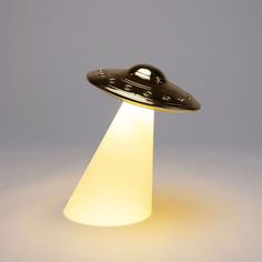 a black and white photo of a light that looks like an alien ship