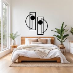 a modern bedroom with white walls and wood flooring