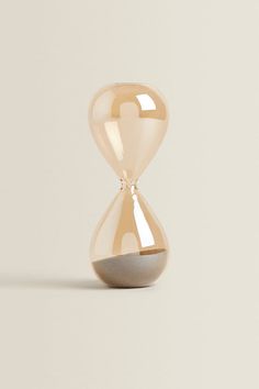 an hourglass sitting on top of a table