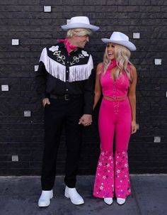 a man and woman dressed in western style clothing