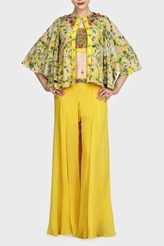 Keep it stylish with this yellow Indo-western printed and embroidered blouse with cape and sharara designed by Nikasha. Blouse With Cape, Sharara Designs, Indo Western, Yellow Print