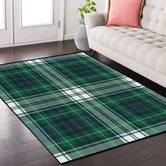 a living room area rug with a green and white tartan plaid pattern on it