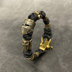 Handmade Black Braided Bracelets For Outdoor, Handmade Black Paracord Braided Bracelet, Gift Jewelry With Adjustable Paracord Cord, Gift Jewelry With Adjustable Paracord, Adjustable Gold Paracord Bracelet, Adjustable Gold Paracord Bracelets, Snake Knot Bracelet, Templar Helmet, Templar Shield