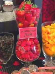 a table topped with lots of fruits and veggies on top of glass bowls