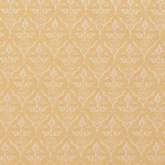 a yellow and white wallpaper with an intricate design on it's surface,