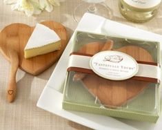 two pieces of cake sitting on top of a white plate next to a wooden spatula