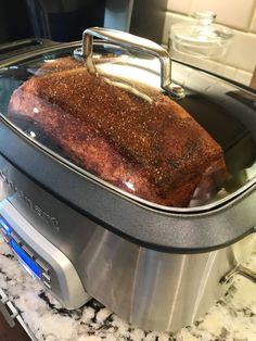 a roaster with some food inside of it