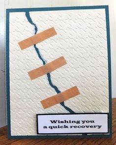 a close up of a greeting card on a table with a piece of paper taped to it