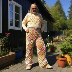 Elevate your fashion game with our Patchwork Trousers, a vibrant and sustainable addition to our Etsy collection. These trousers are a testament to individuality and conscious fashion, meticulously crafted from a diverse array of repurposed fabrics. Each pair tells a unique story through its blend of colors, patterns, and textures, making them a true work of art. Designed for comfort and style, the elastic waistband ensures a flexible fit for any body shape. The wide-legged silhouette not only adds a touch of bohemian flair but also provides maximum comfort for all-day wear. Whether you're wandering through a local market, dancing at a festival, or enjoying a casual day out, these trousers effortlessly combine fashion and functionality. What sets our Patchwork Trousers apart is their commi Multicolor Loungewear Bottoms For Fall, Multicolor Bottoms For Loungewear In Fall, Multicolor Bottoms For Fall Loungewear, Multicolor Straight Pants For Loungewear, Granny Square Trousers, Patchwork Trousers, Knitted Pants, Pants Gift, Conscious Fashion