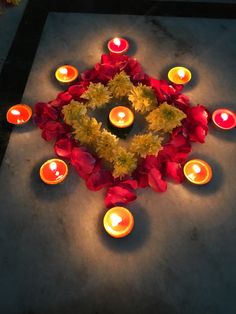 a bunch of candles that are on the ground