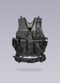 Enhance your performance during outdoor activities with this fake bulletproof armor suit. Unleash the warrior within you with our Bulletproof Military Vest, a testament to the modern urban male's fierce strength and unyielding resilience. This sartorial marvel is not just a piece of clothing; it is an embodiment of power and control, a tribute to those who dare to navigate the urban landscape with audacity and finesse. Crafted with a keen eye for aesthetics and utility, this black faux bulletproof vest seamlessly transitions from a high-stakes paintball match to a demanding urban exploration. Enriched with a plethora of features and materials - velcro, straps, buckles, cargo pockets, mesh and an integrated front belt - this combat tactical vest exudes an air of unmatched functionality. It' Bulletproof Armor, Bulletproof Clothing, Urban Warrior, Bulletproof Vest, Armor Suit, Apocalyptic Clothing, Military Vest, Warrior Within, Military Armor