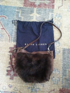 Vintage Ralph Lauren Shearling and Leather Brown Hobo Bag Large Shoulder bag  with Interior Pockets and Organizer. Used only a couple times. May be minor scuffs or marks to the fur and or leather.   Interior is very clean. Dust Bag I have loved and very gently used my Ralph Lauren items.  Since the late 70's. I started my love affair with Ralph, I love the timeless American look that he captures.  Always in style, always appropriate.  Hope you enjoyed seeing one of my favorite vintage items. Ple Birthday Present For Husband, Indian Blankets, Ralph Lauren Skirts, Floral Handbags, Fabric Handbags, Fur Bag, Lauren Brown, Vintage Ralph Lauren, Ralph Lauren Collection